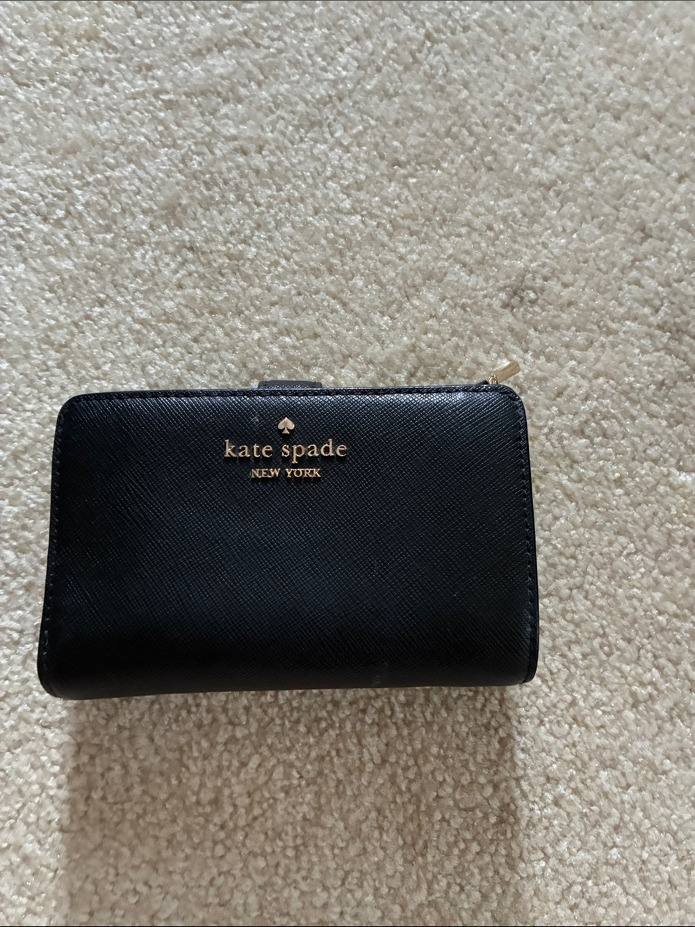 kate spade black zip-around Saffiano leather wallet with gold logo